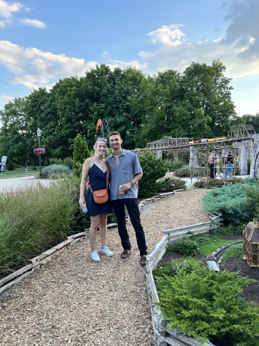 Michal and Austin on a garden path
